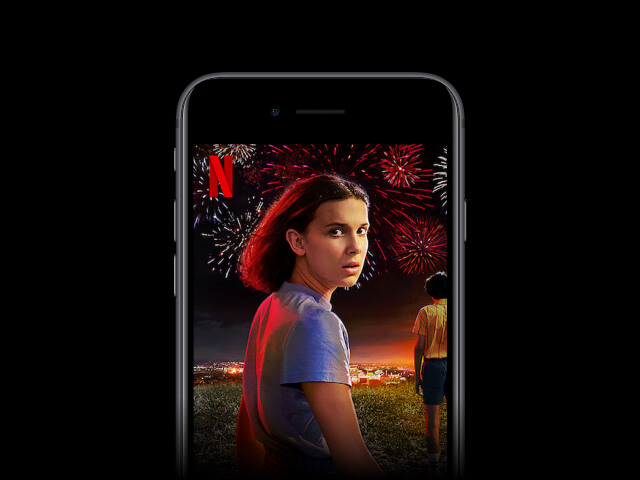 Mobile phone downloading Stranger Things TV show